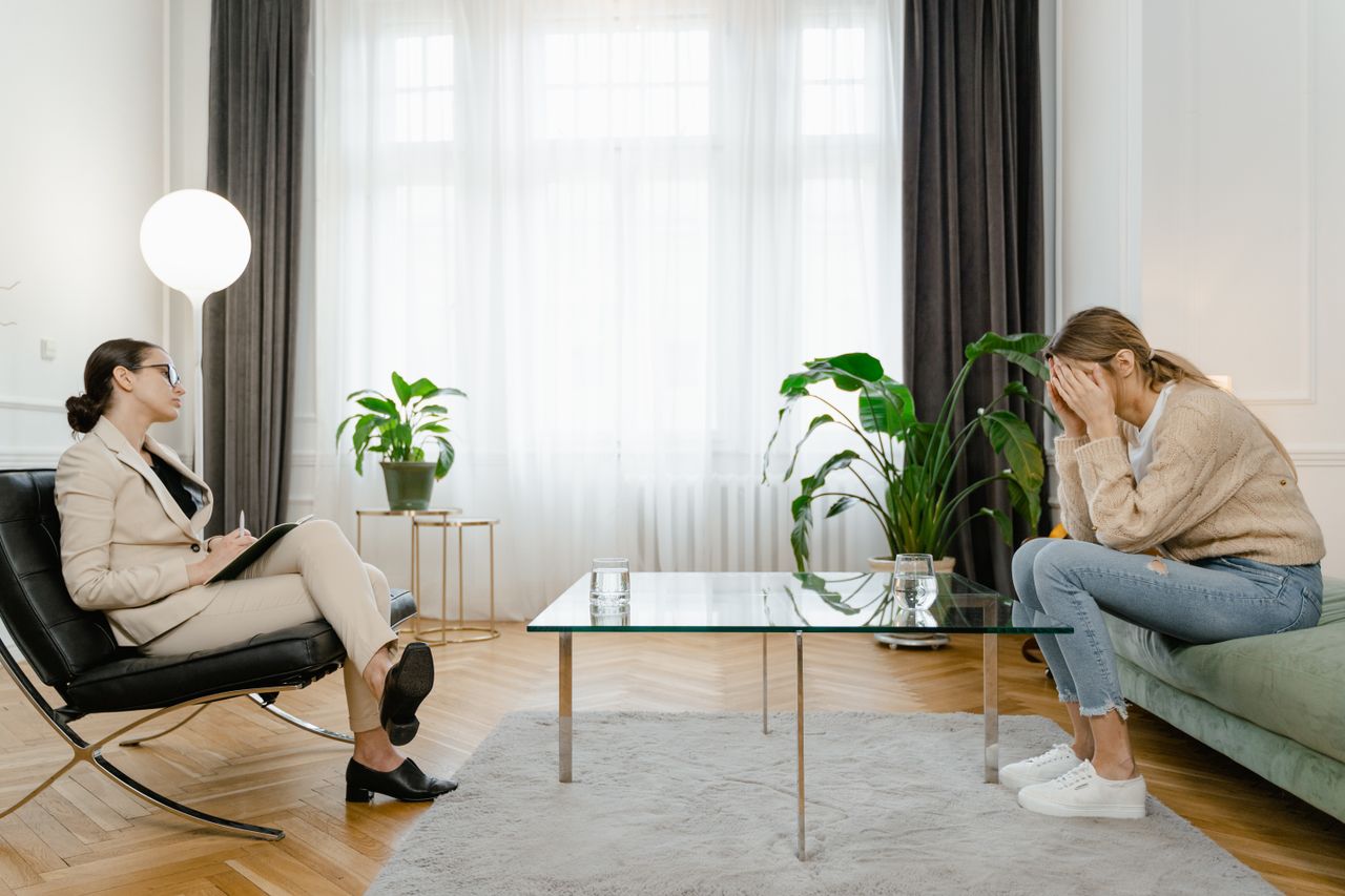 Mastering the First Impression: Your intriguing post title goes here A therapist and a client in a modern office setting during a counseling session.