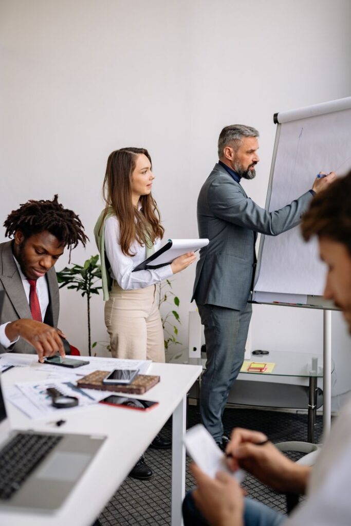 Professional team engaged in a business meeting with a focus on collaboration and planning.